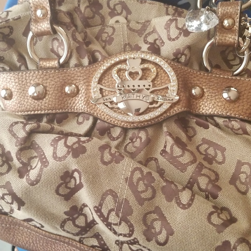 Kathy Van Zeeland gold purse looks new